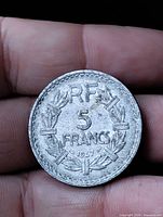 Reverse view showing RF 5 FRANCS 1947 within laurel wreath