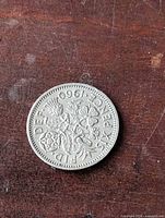 Reverse showing 1960 date, denomination SIX PENCE and floral design