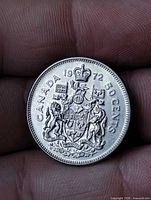 Reverse side of 1972 Canada 50 cent coin showing coat of arms