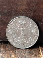 Reverse side with crowned eagle and floral scrolls