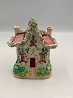 Front view of Staffordshire ceramic cottage house ornament