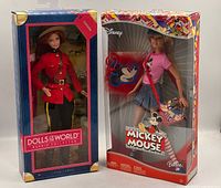 Front view of both boxed Barbie dolls