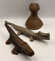 Group shot of two alligator nutcrackers and doorstop