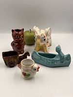 Group shot of all five ceramic planters