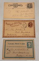 Fronts of three postal cards showing printed indicia and addresses