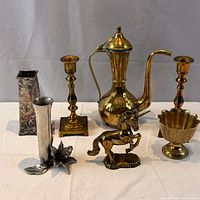 Full lot group shot showing all seven metal decor items