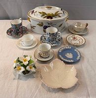 Group shot showing all pieces including covered dish, five cup & saucer sets, ashtray, trinket dish, flower posy