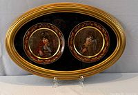 Front view of oval frame showing both plates