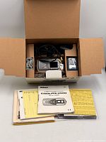 Closed Nikon Coolpix 3500 boxed set showing manuals, CD, accessories inside