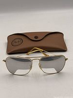 Sunglasses front view with case behind