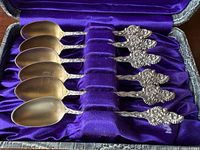 Six sterling teaspoons in purple velvet case