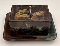 top view of glazed rectangular butter dish on tray