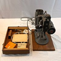 Projector on case with accessories displayed