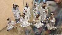 group shot of all eight Shiwan mudman figurines