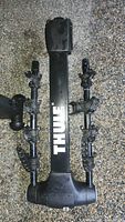 Front view of Thule hitch bike rack showing logo, arms, cradles, and 1.25 in hitch shank