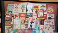 Group shot of all humour books laid out showing covers and titles