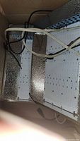 LED grow light fixture showing three LED boards and wiring