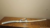 Sword sheathed showing full scabbard and handle