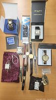 Overview of all boxed, packaged and loose watches on table