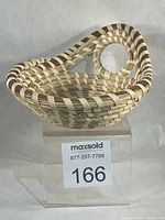 front three-quarter view showing basket form, handle and weave