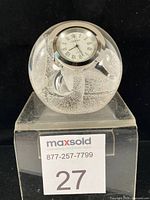 Front view showing clock face and bubble swirl