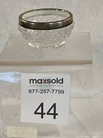 Side view of salt cellar on display block