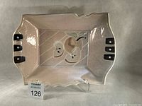 Front view of platter showing full shape and decoration