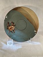 Front view of entire platter showing glaze, crab figure and altered rim