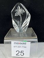 Front view showing frosted iris motif within clear crystal