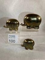 front view of all three brass elephants displaying size differences