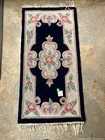 Full view of rectangular Serena Aubusson wool rug showing entire design and fringe