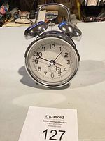 Front view of silver twin bell alarm clock