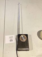 Full view of GE portable radio with antennas extended