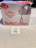 Front of box displaying Betty Crocker 5-speed hand mixer image and branding