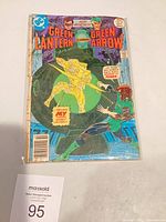Front cover of bagged comic displaying title, issue number 97, characters