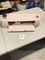 Front view of pink Cricut Explore Air 2 on table