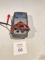 Front view of Mastercraft digital multimeter with coiled test leads