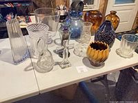 Wide shot of all glass and crystal items on table