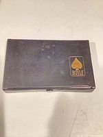 Closed black case with gold Hoyle logo