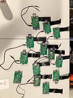 All 13 circuit boards laid out showing ribbon cables and daughterboards