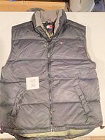 Full front view of puffer vest showing overall design and condition