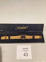 Watch in open Xavier case showing full bracelet and dial