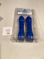 Front view of sealed package showing both blue dumbbells