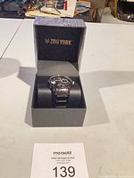 Watch inside open Zoo York presentation box on table