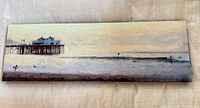 Front view of aluminum artwork showing full Malibu pier scene