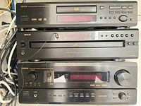 Front view of stacked Denon DVD-1000, DCM-290, AVR-3901 showing displays and controls