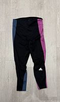 Front view of colour-block Adidas leggings