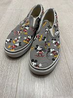 Top view of both sneakers showing Mickey Mouse print and overall condition