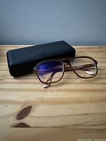 Front view of Etnia Barcelona brown tortoise frames with case