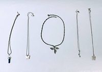 Full view of all five necklaces laid out